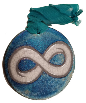 Infinite Silhouette Medallion Ornament from Raku Pottery